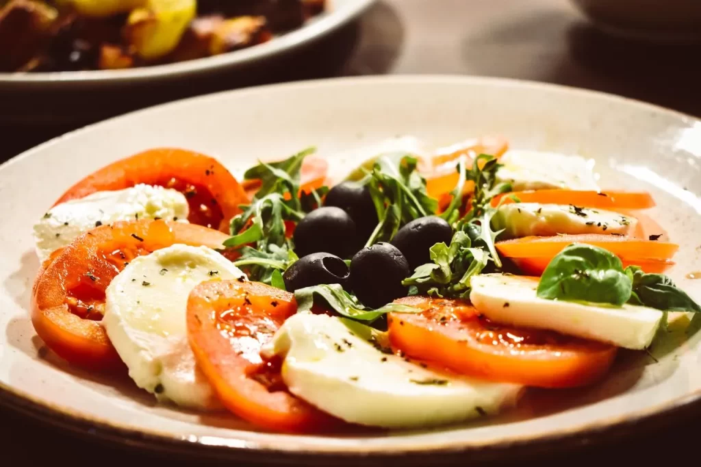 Fresh tomato, mozzarella, and basil salad with black olives at Konoba Malo Misto in Zadar