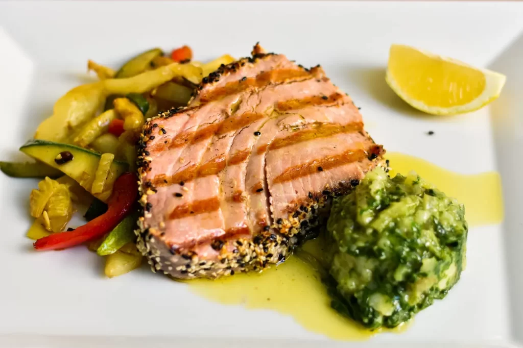 Sesame-crusted seared tuna steak with Swiss chard and lemon at Konoba Malo Misto restaurant in Zadar